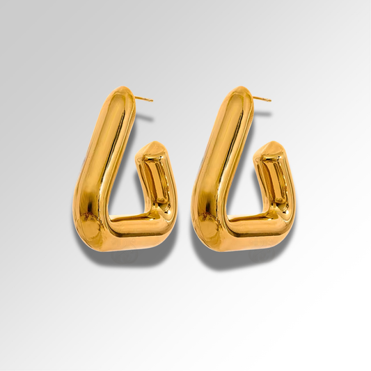 Gold plated geometric hoop earrings with a soft sculptural curve

