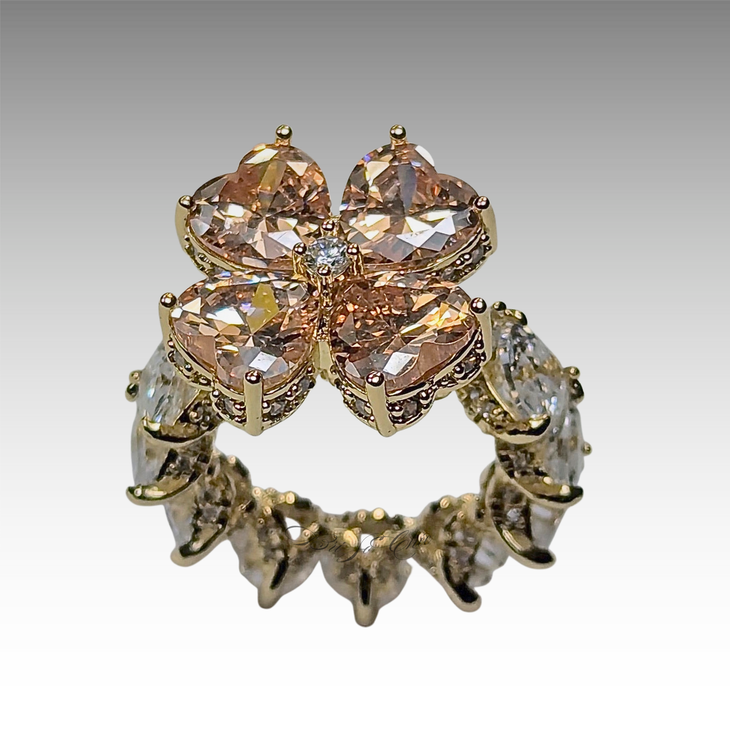 Brown Clover ring with white gemstones and gold tone